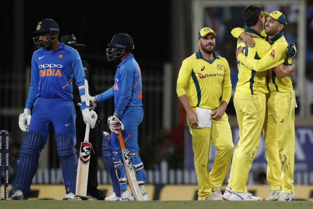 Australia celebrates its win in the third one day international cricket match between India and Australia in Ranchi in India on Friday.