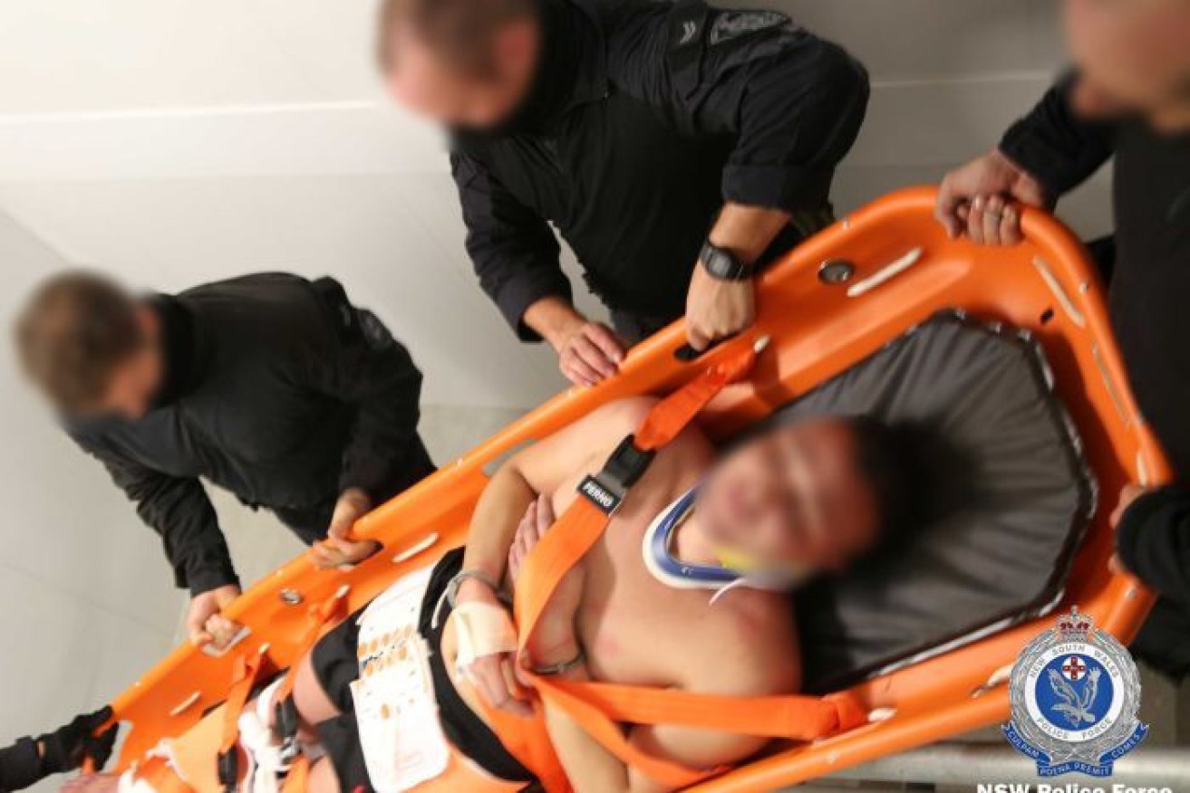 One man was injured when he tried to jump from a balcony as officers tried to arrest him.