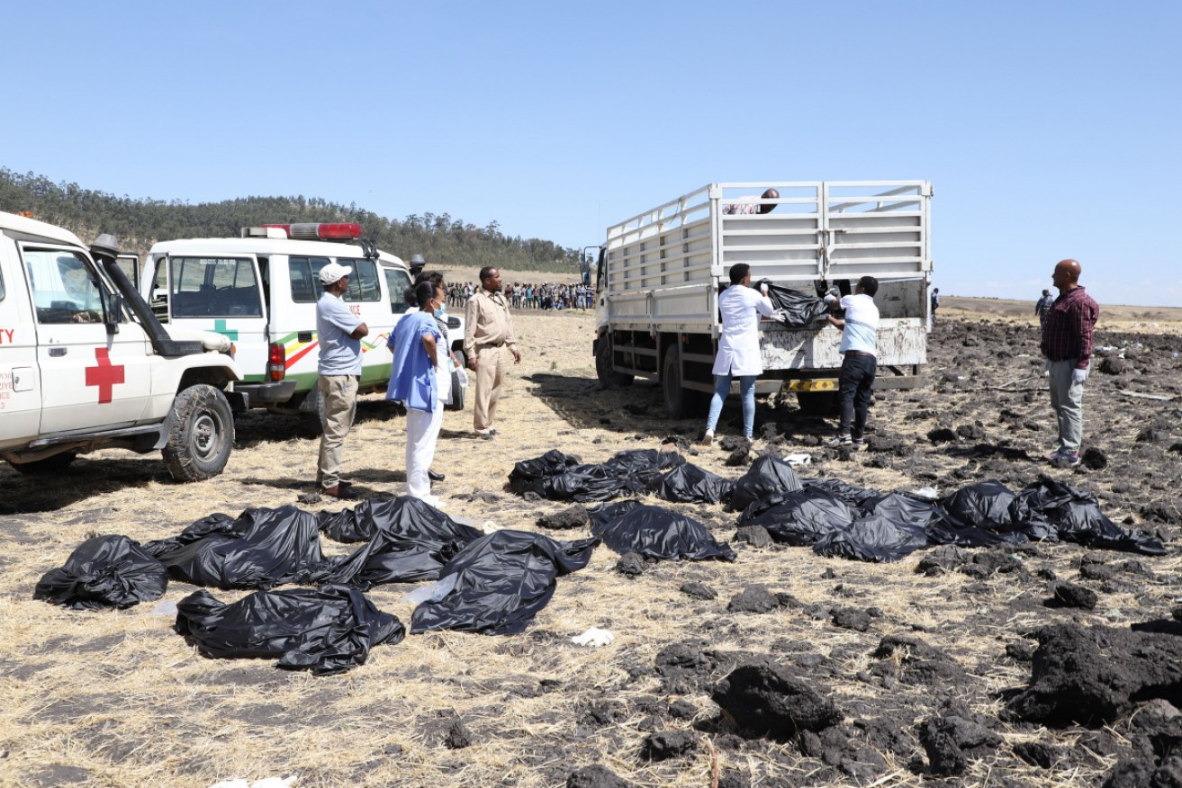 Recovery efforts begin at Ethiopian plane crash site to take bodies home to families. 