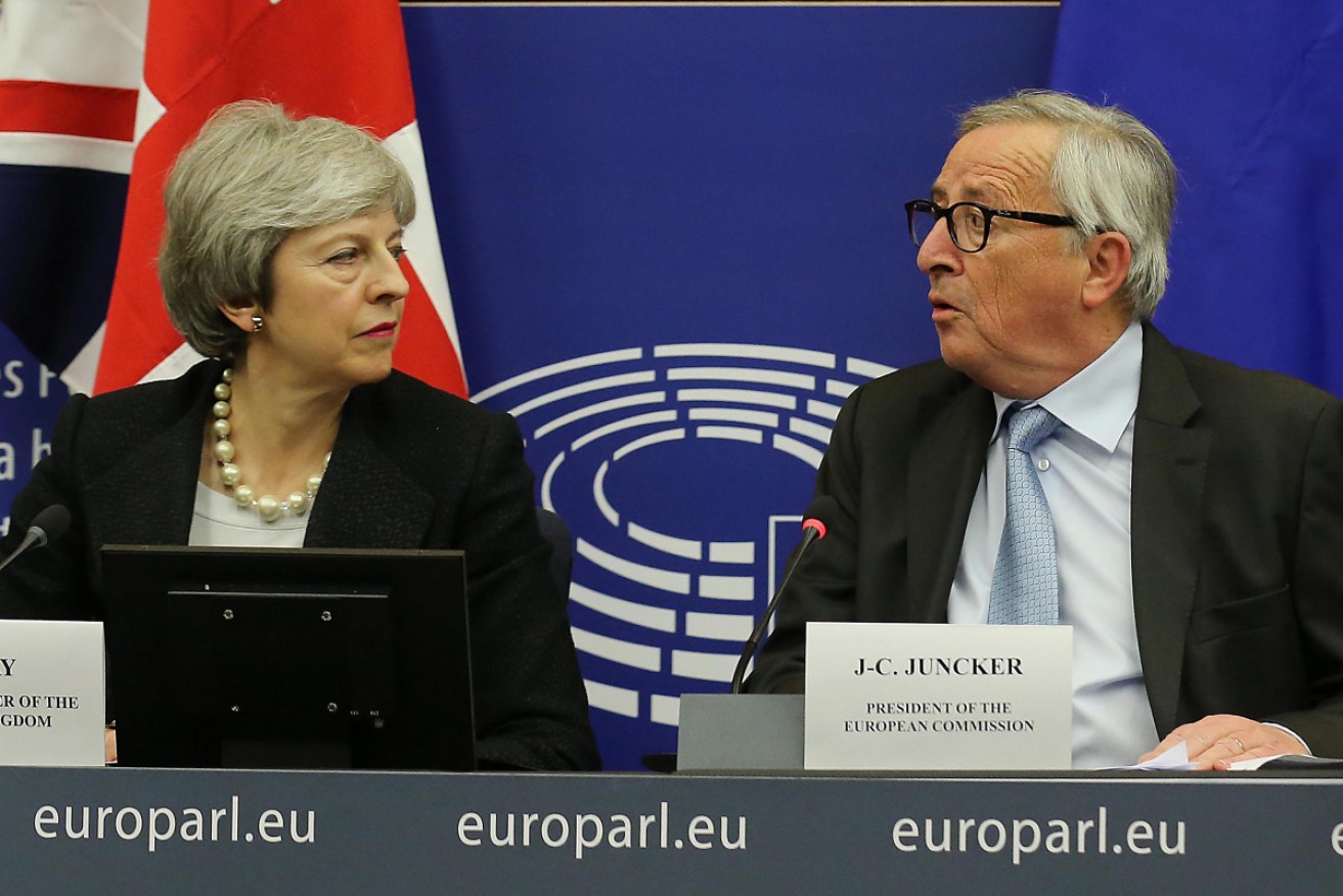 Theresa May and Jean-Claude Juncker announce their new Brexit "assurances".