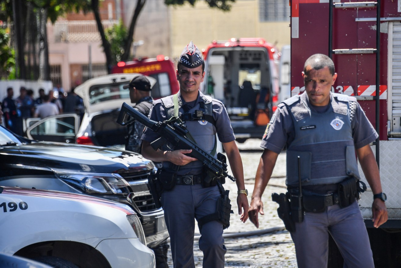 Police work at the scene of a shooting at a school in Suzano, Sao Paulo metropolitan region, Brazil.