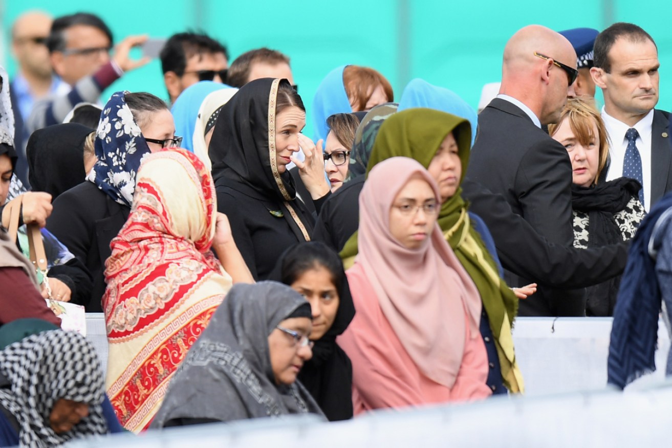 PM Jacinda Ardern reacts as she attends prayers in Hagley Park near Al Noor mosque on Friday.