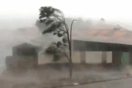 Cyclone red alert lifted in parts of Pilbara but winds, floods continue