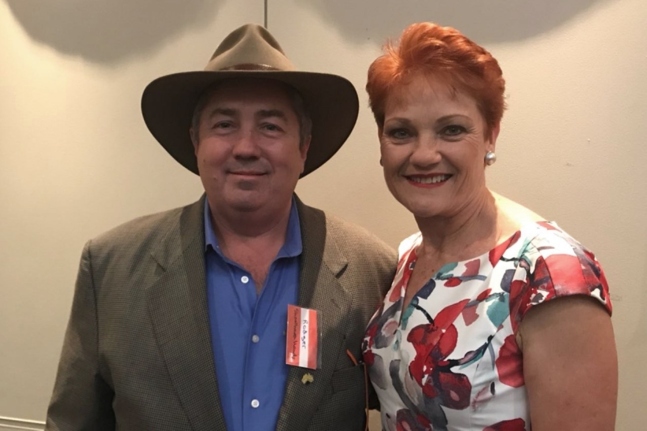 Investigative journalist Rodger Muller, who went undercover in the gun lobby sting, poses with Pauline Hanson.