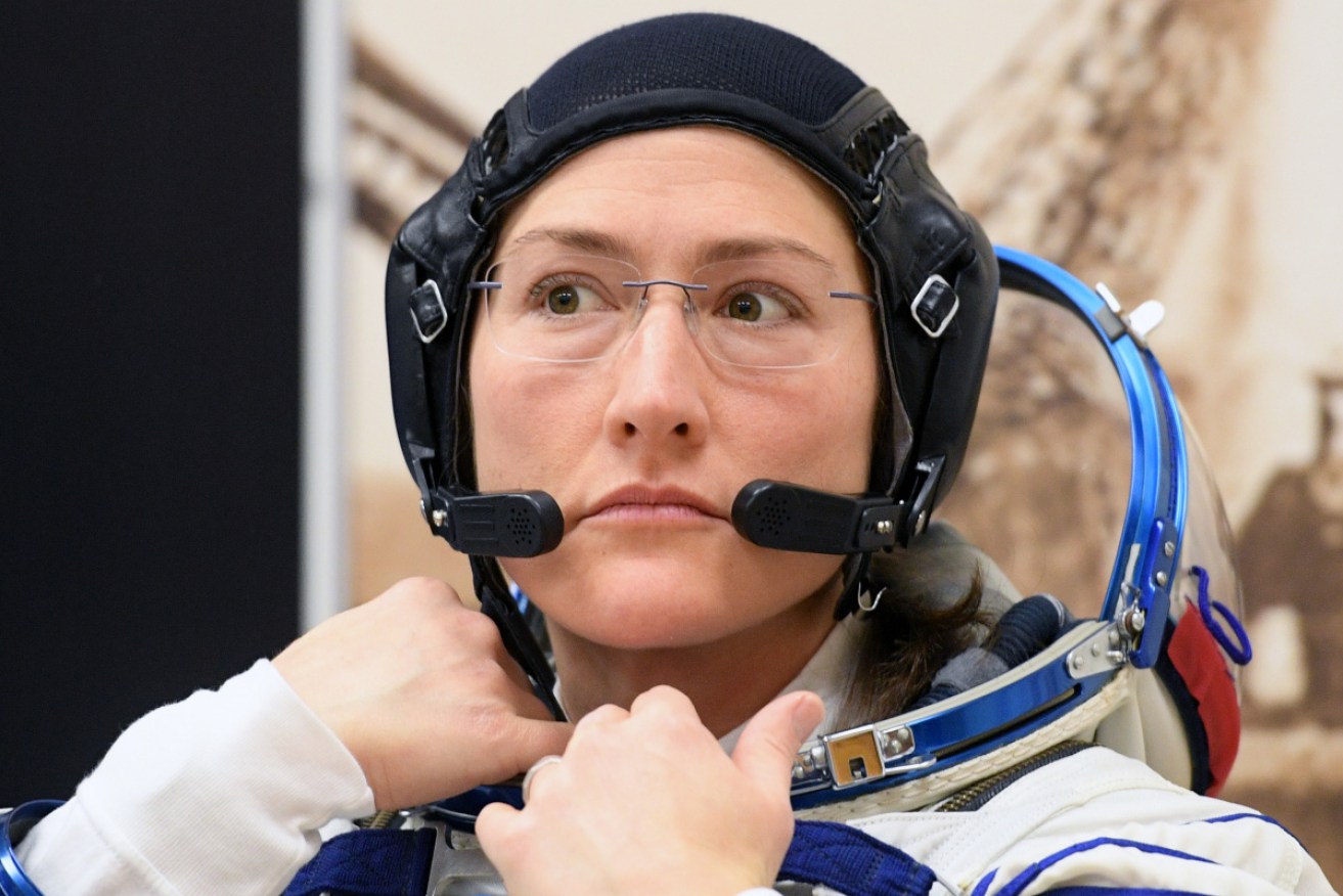Christina Koch, a member of the International Space Station (ISS) expedition 59/60, tests her spacesuit on March 14. 
