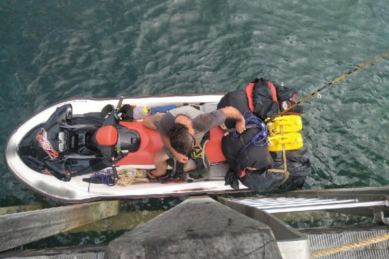 A British man has been arrested after attempting to flee Australia by jet ski. 