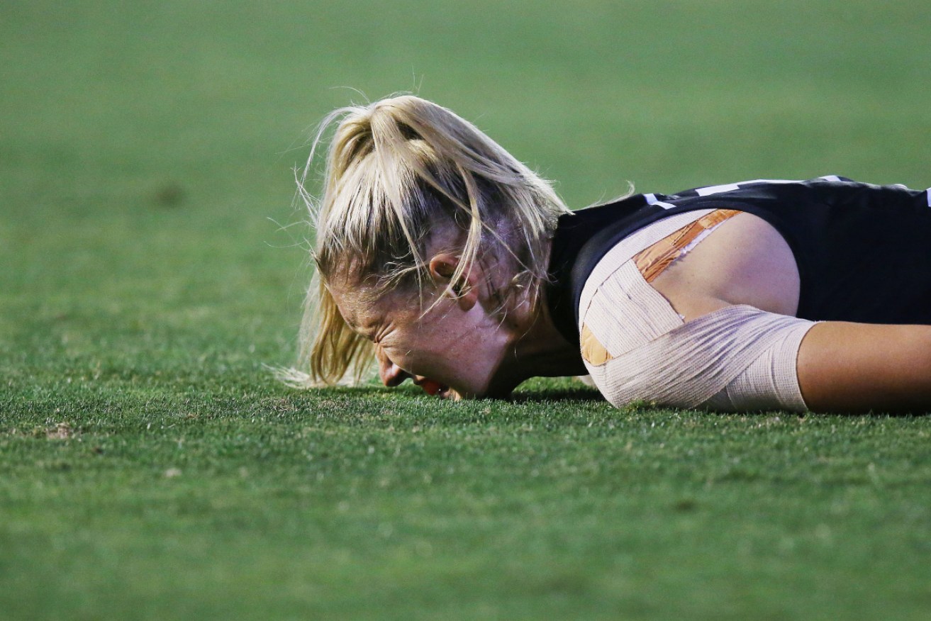 Hard work: Carlton's Tayla Harris hits the deck during the AFLW season. 