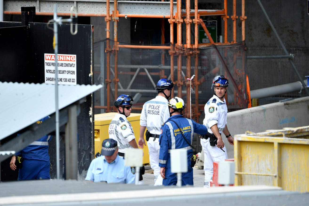 Rescue workers at the scene of the scaffolding collapse where Christopher Cassaniti died in April.