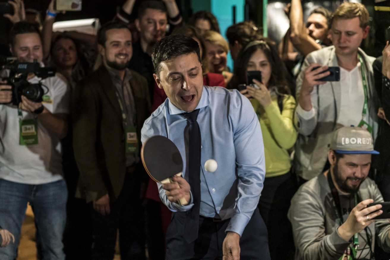 Comedian and presidential candidate Volodymyr Zelenskiy plays table tennis at his election party.