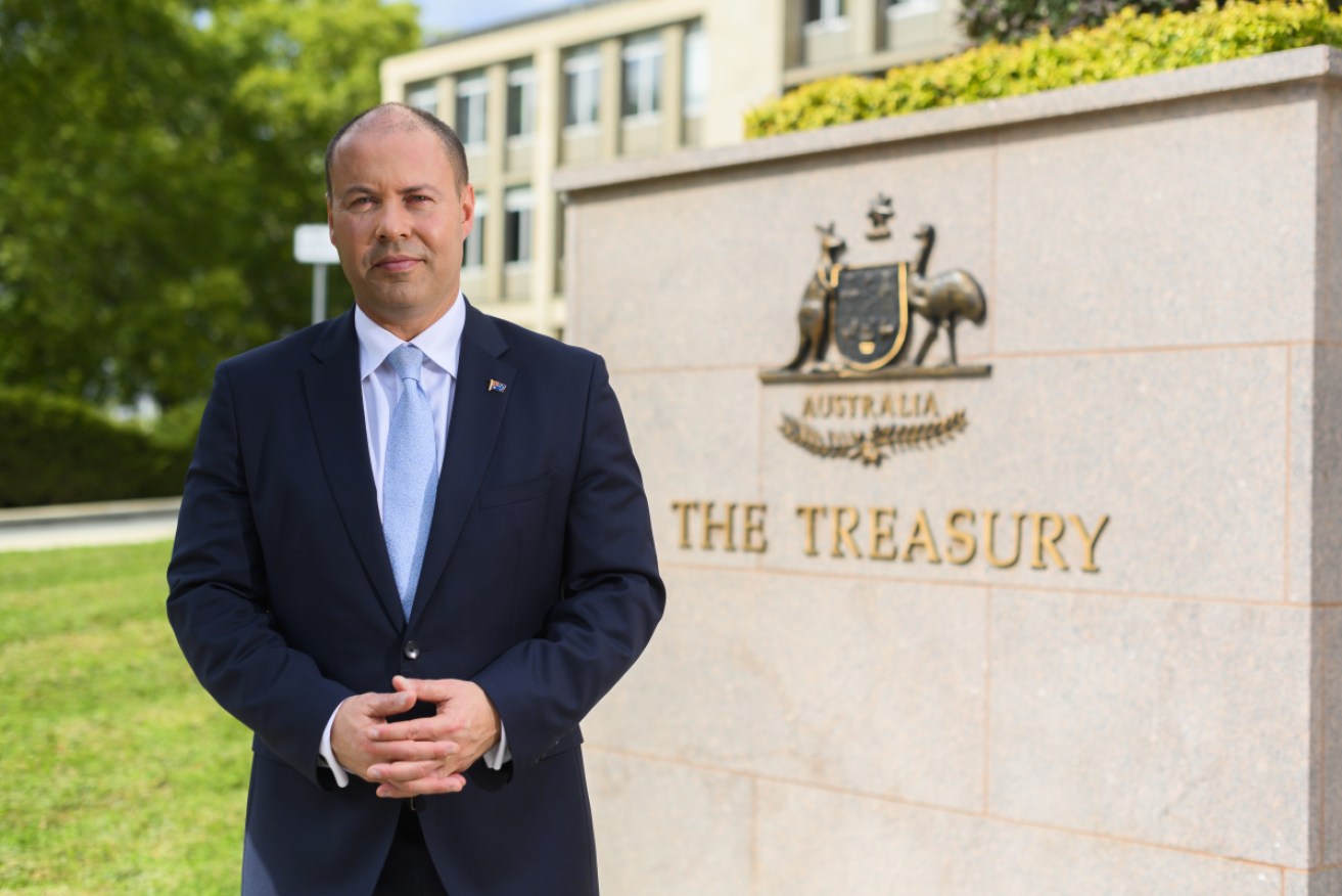 Treasurer Josh Frydenberg prepares for his first budget outside the Treasury building in Canberra.