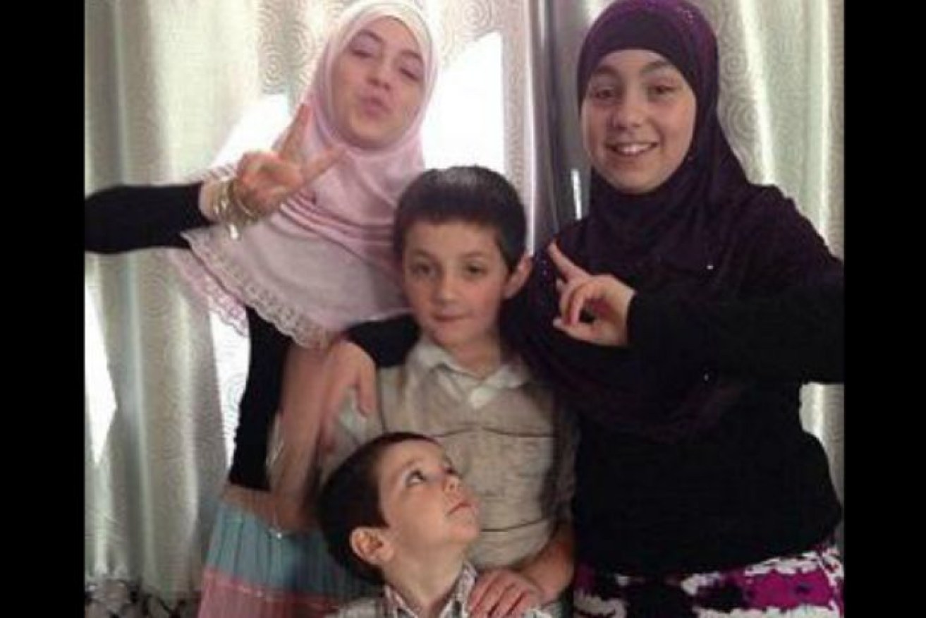 Khaled Sharrouf's children Zaynab (pink scarf), Hoda (black scarf), Abdullah (centre, deceased) and Humzeh (front).