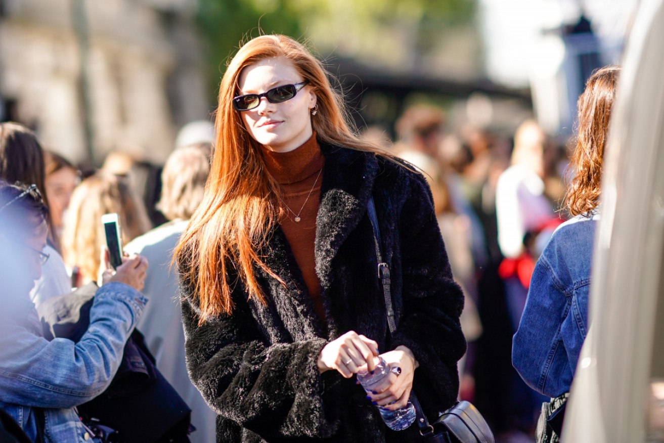 A woman wearing a fake fur coat during Paris Fashion Week