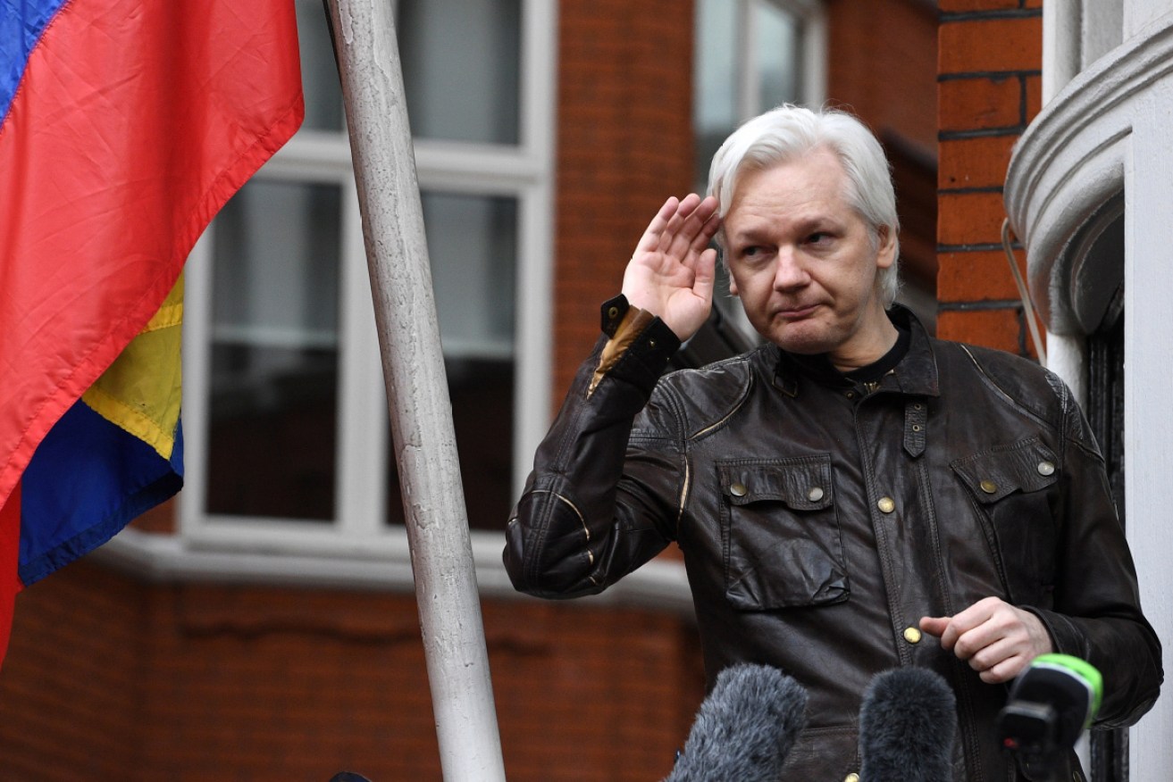 It's not farewell just yet. Assange briefly steps out on the Ecuadorian embassy's balcony in 2017.