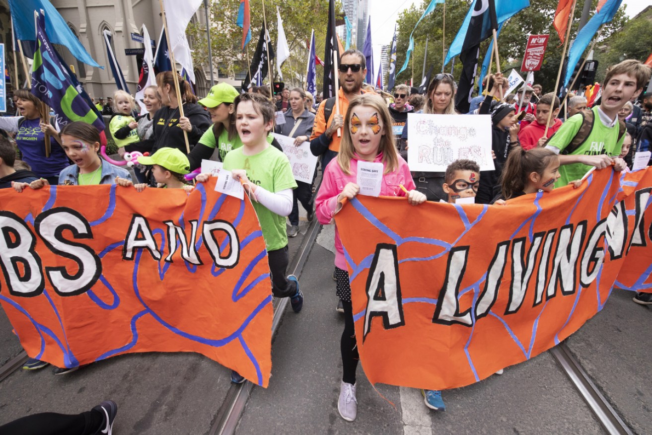 An estimated 100,000 people marched for workers' rights in Melbourne.
