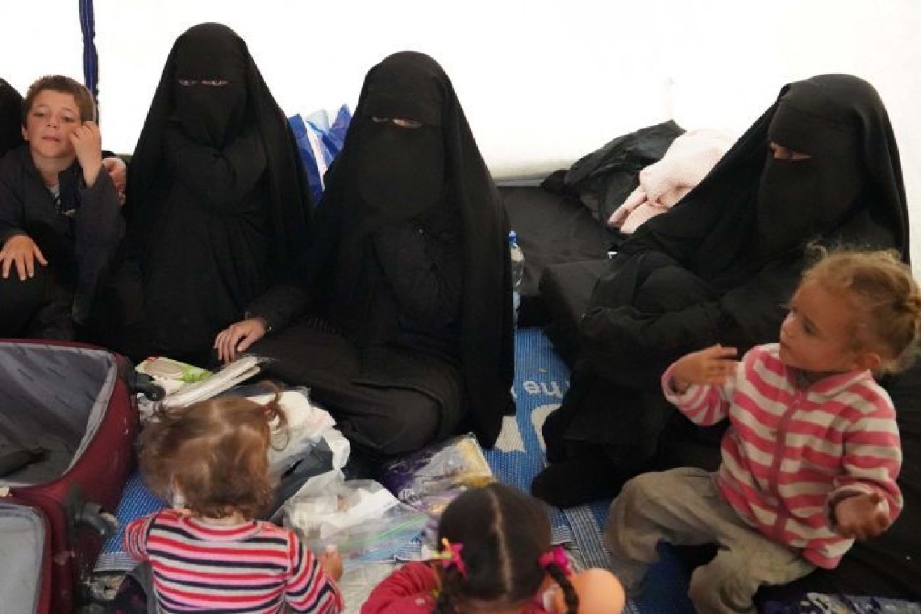 Humzeh, Hoda and Zaynab Sharrouf, Zaynab's children and another Australian woman and her daughter in their tent in the al-Hawl refugee camp.

