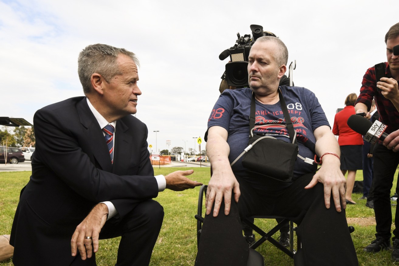 Rob Gibbs speaks to Bill Shorten after confronting him about Labor's health pledges.