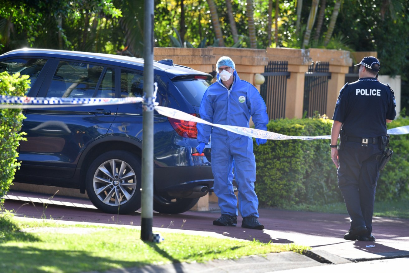 Police at the home of a Brisbane doctor who was shot dead late on Monday.
