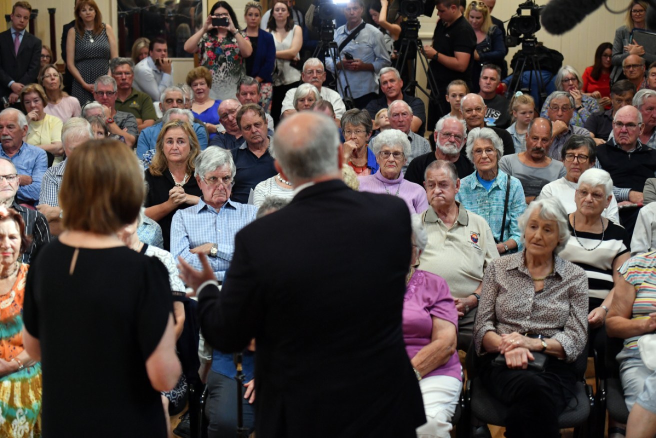 PM Scott Morrison and Liberal member for Corangamite Sarah Henderson with senior citizens in Drysdale, Victoria, on Tuesday.