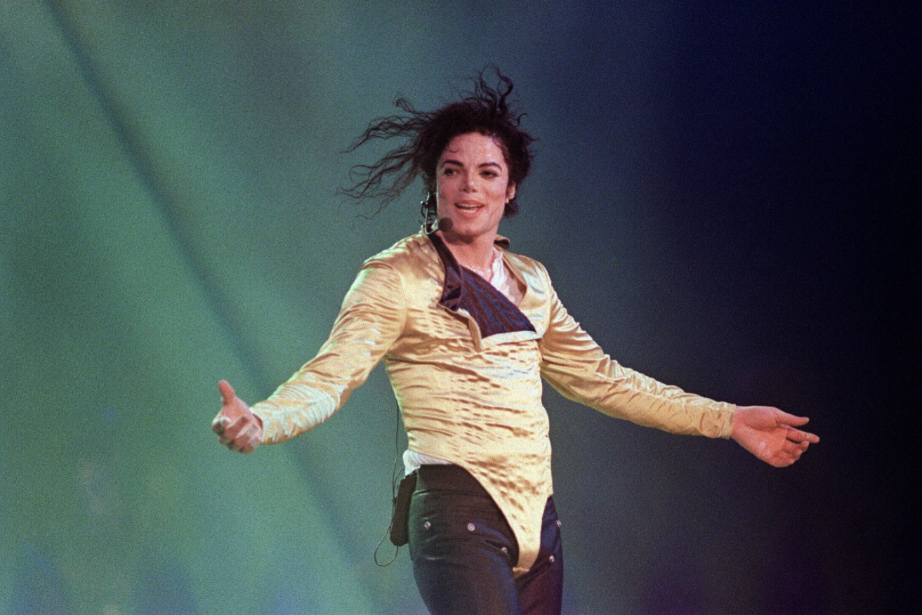 Biographers have been forced to reassess their view of Michael Jackson after the release of documentary <i>Finding Neverland</i>.
