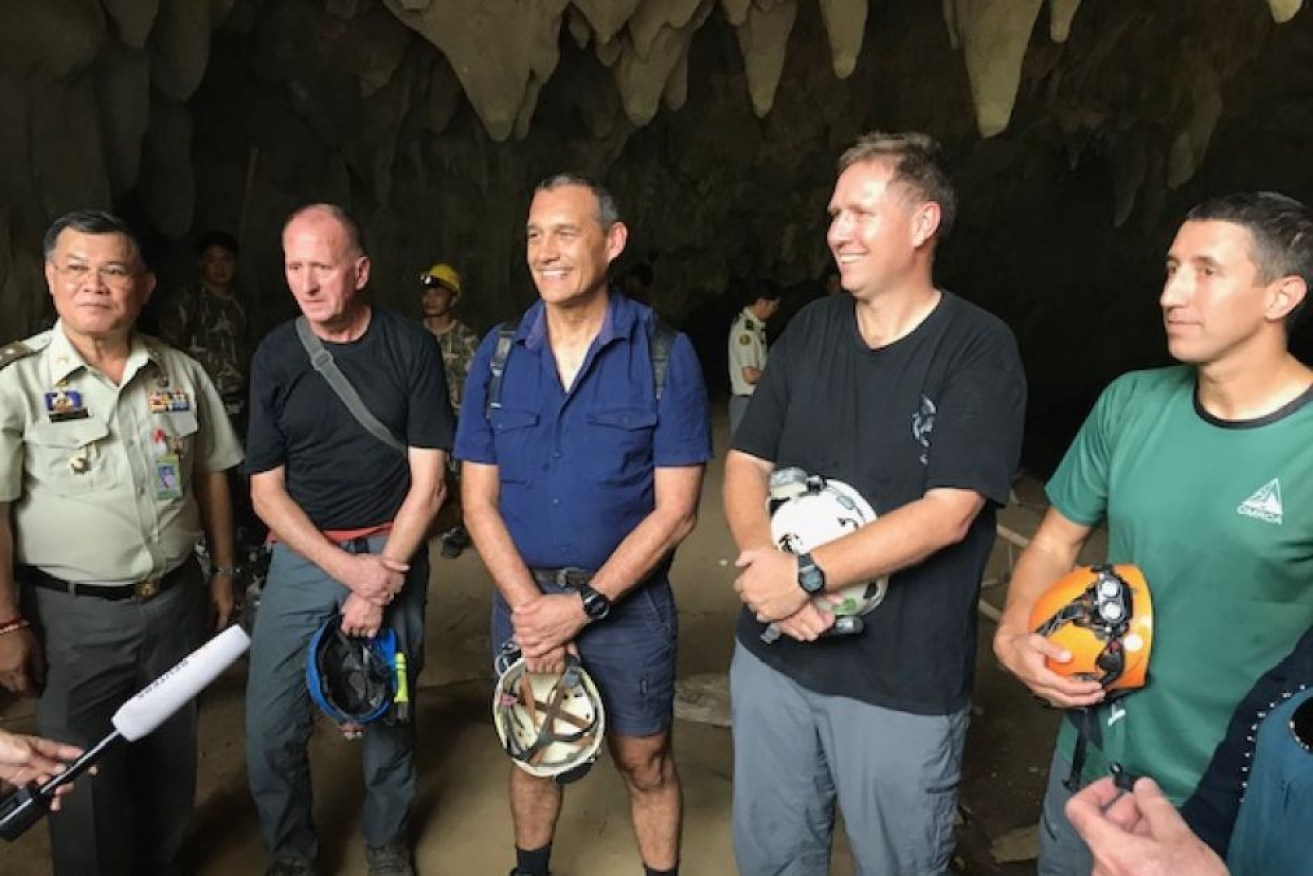 A Thai national parks official, Vern Unsworth, Dr Craig Challen, Dr Richard Harris, Josh Morris (a locally-based caver).