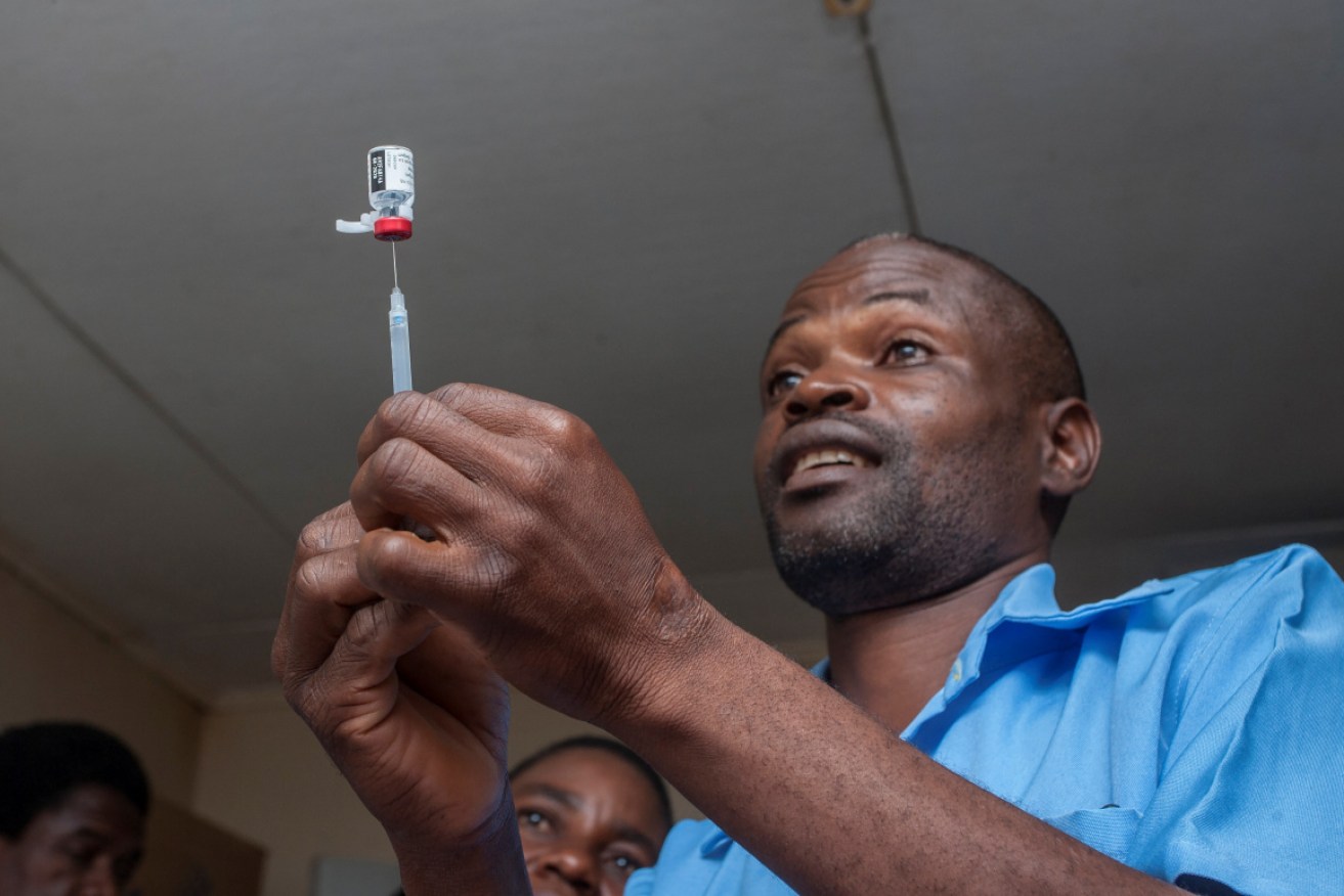 A health worker in Malawi with the new malaria vaccine.