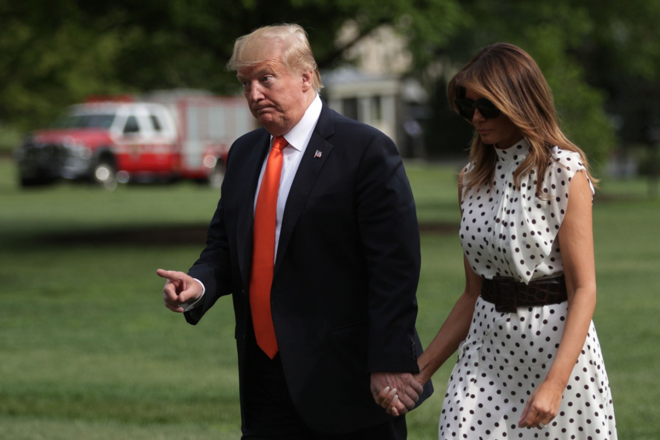 US President Donald Trump and First Lady Melania Trump return to the White House on Wednesday in Washington, DC.

