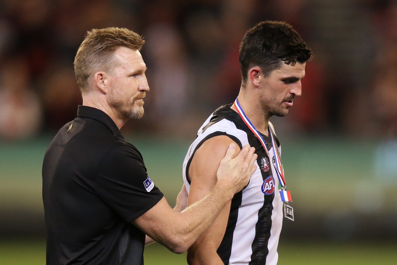 Champion: Nathan Buckley offers his support to Collingwood skipper Scott Pendlebury. 