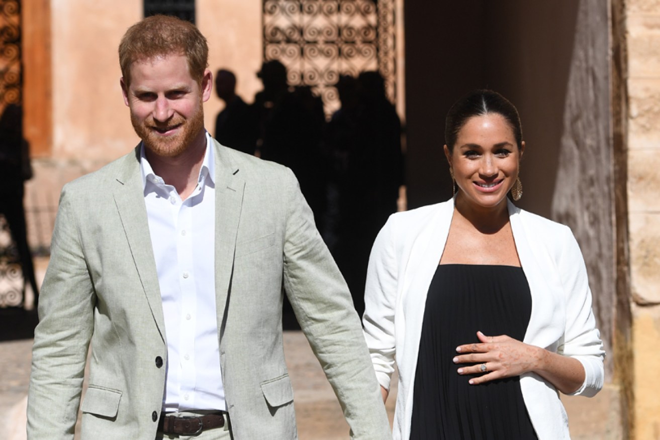 Home and away: Prince Harry and Meghan Markle in Morocco on February 25 during one of their trips.
