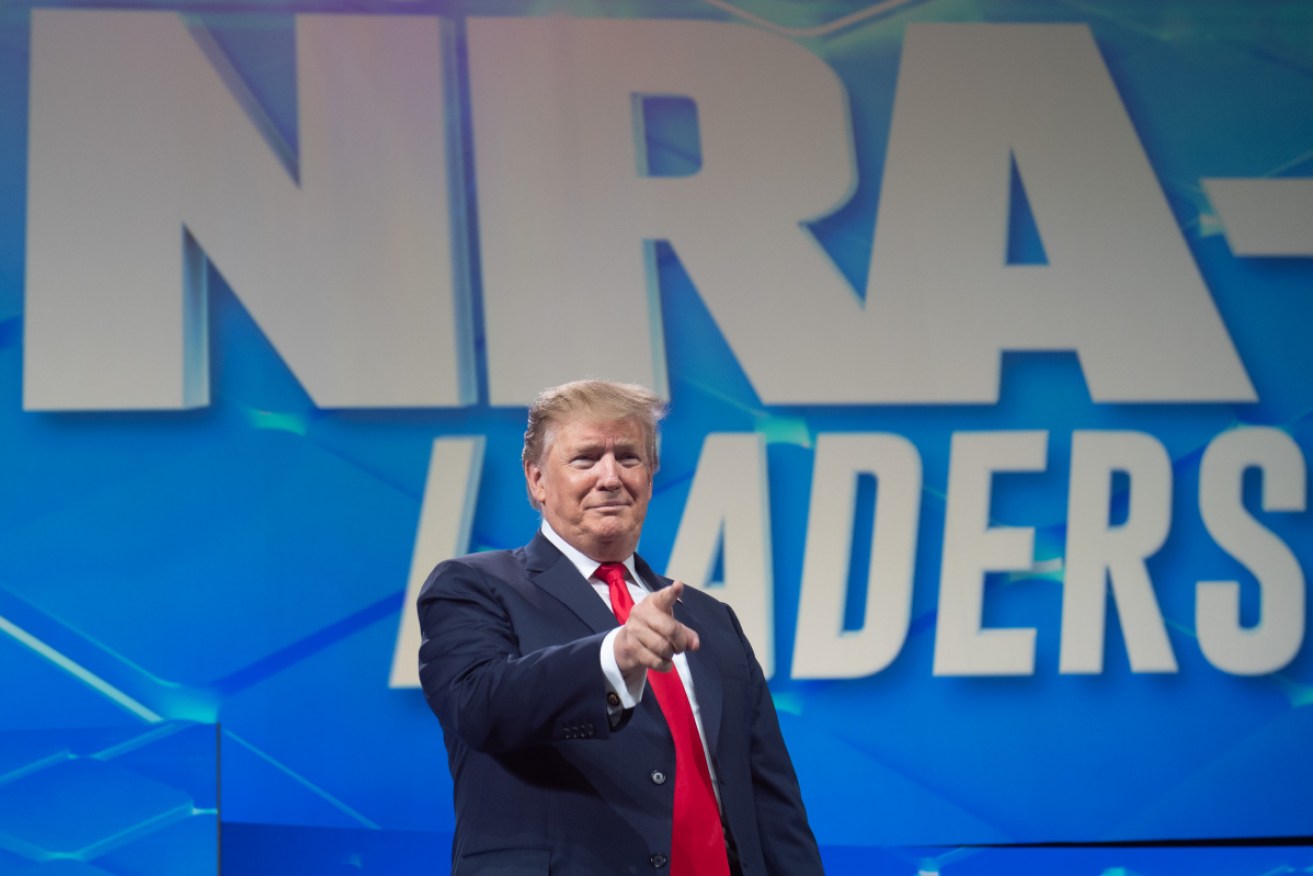Mr Trump addresses the NRA's annual meeting in Indianapolis.