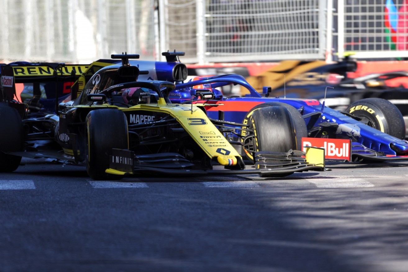 Daniel Ricciardo reverses his Renault into Daniil Kvyat's Toro Rosso. 