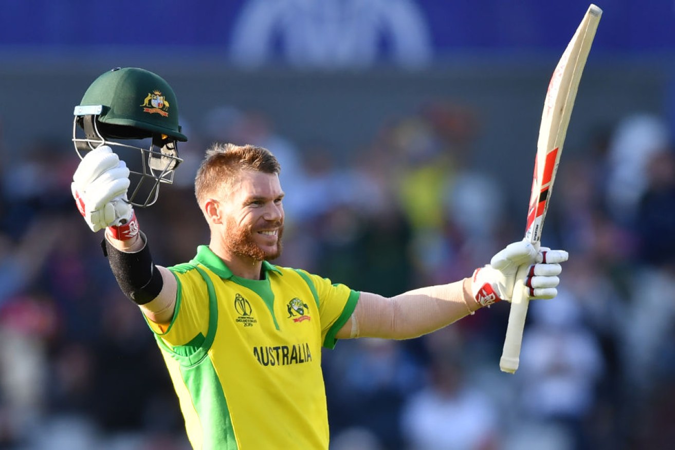 Australia's David Warner celebrates his ton against South Africa at Old Trafford in Manchester on Sunday. 