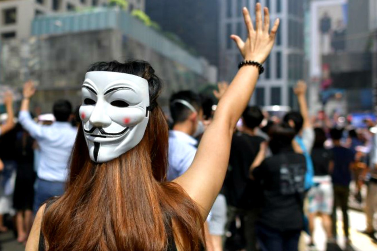 Hong Kong protesters have again taken to the streets, this time defying a ban on face masks.