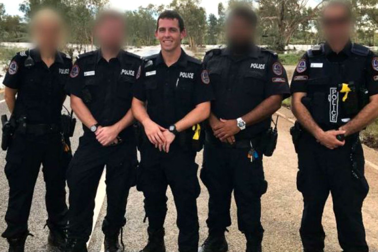 Constable Zachary Rolfe (middle) has been charged with the murder of Warlpiri man Kumanjayi Walker.