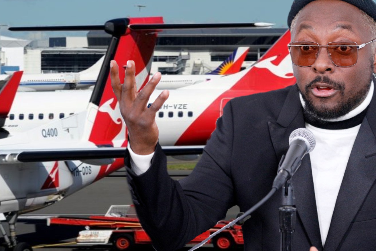 Qantas has supported its flight attendant after a racism row with rapper will.i.am.