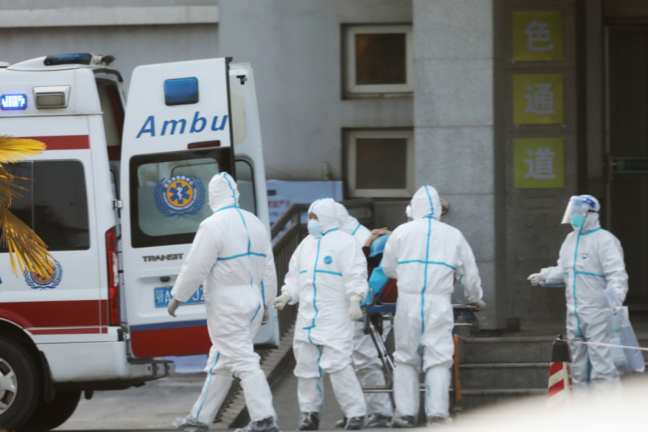 Medical staff transfer patients to Jinyintan hospital where patients infected with a new strain of Coronavirus identified as the cause of the Wuhan pneumonia outbreak are treated in Wuhan, Hubei province, China, 20 January 2020.