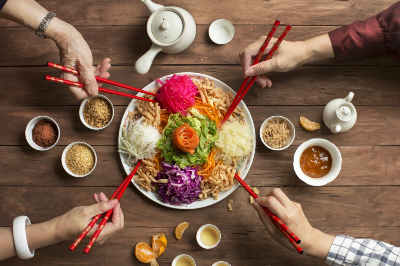 Each ingredient in yee sang represents a blessing for the coming year.
