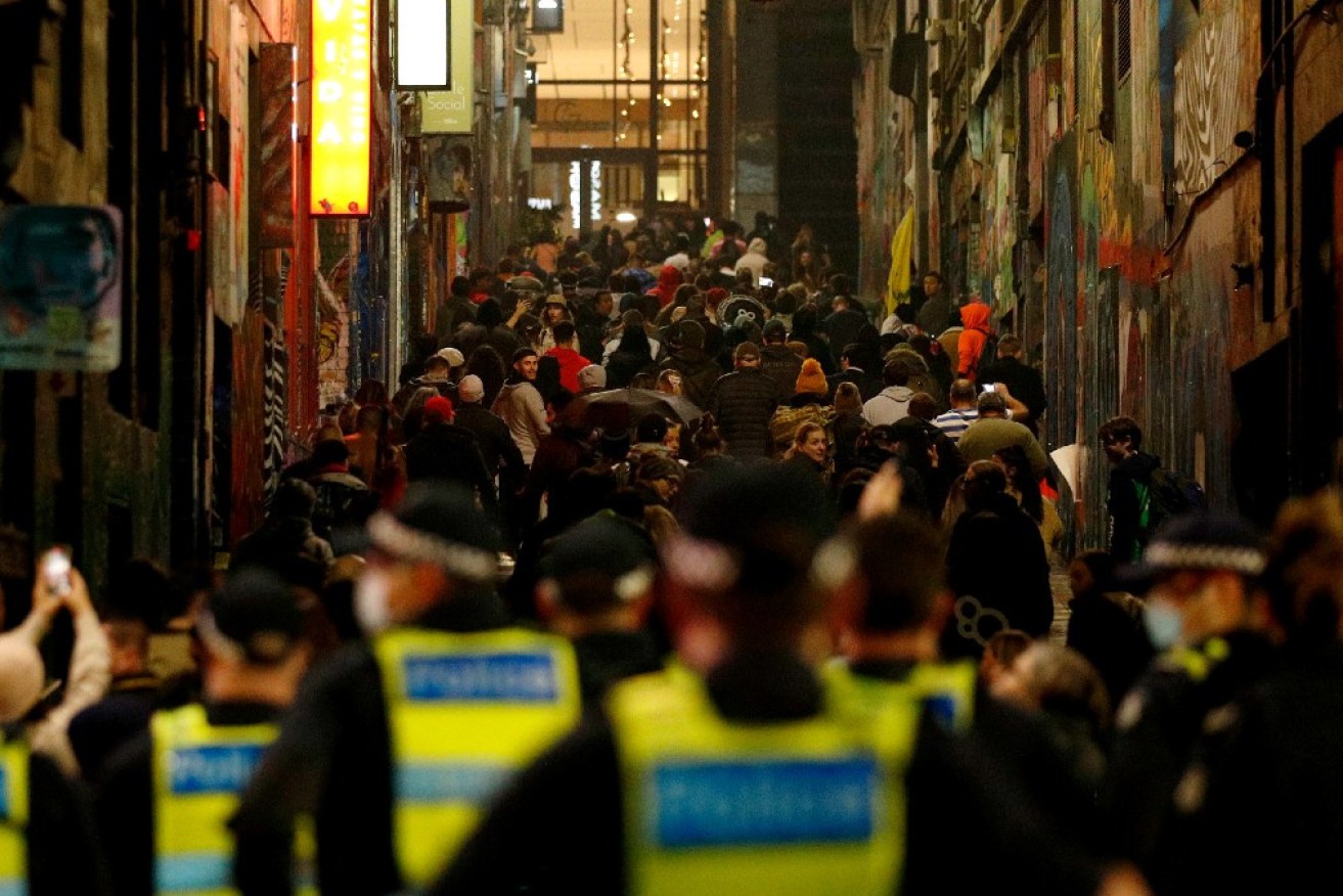 Marchers confront police at last week's rally on the night the latest Victorian lockdown began.