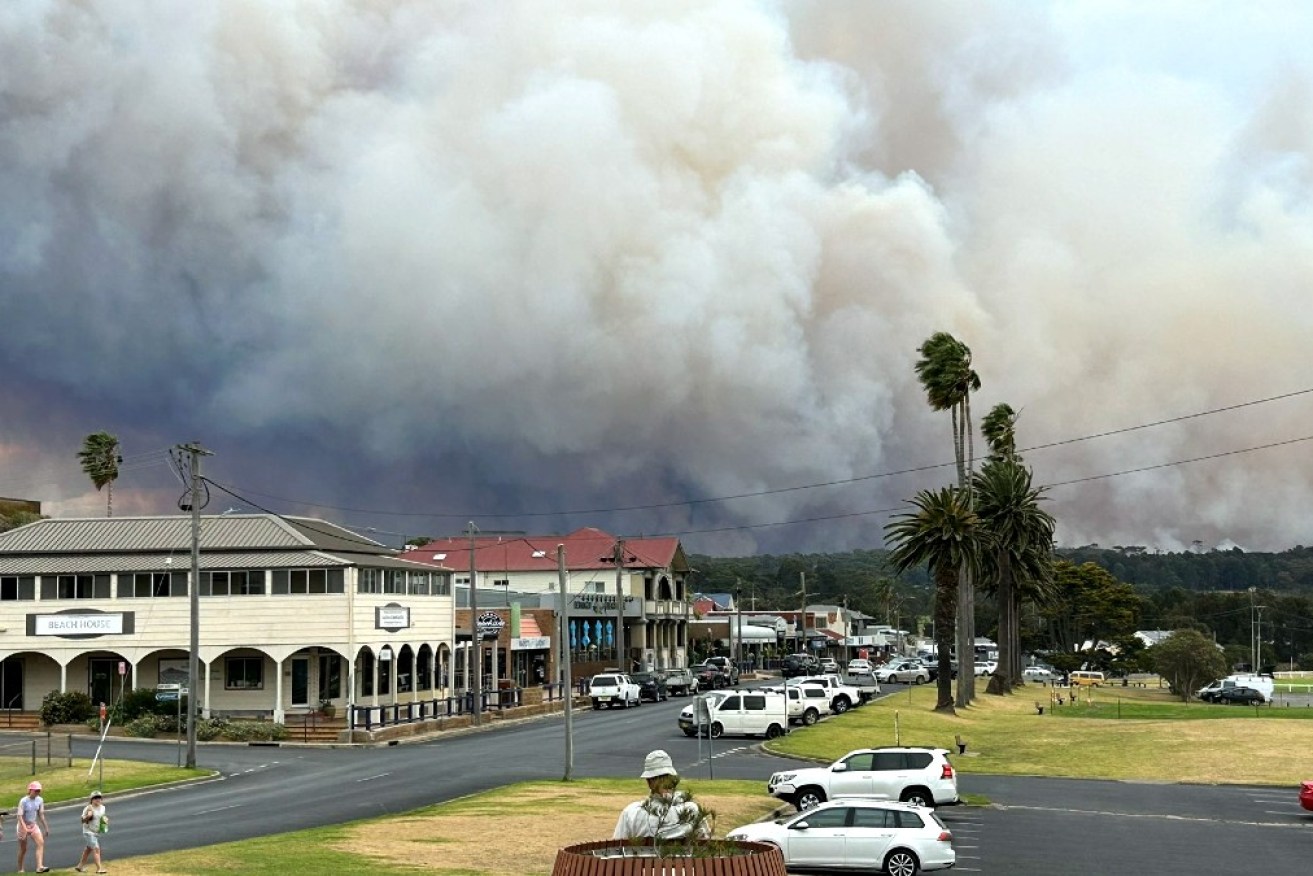 A fire looming behind Bermagui on the NSW south coast. 