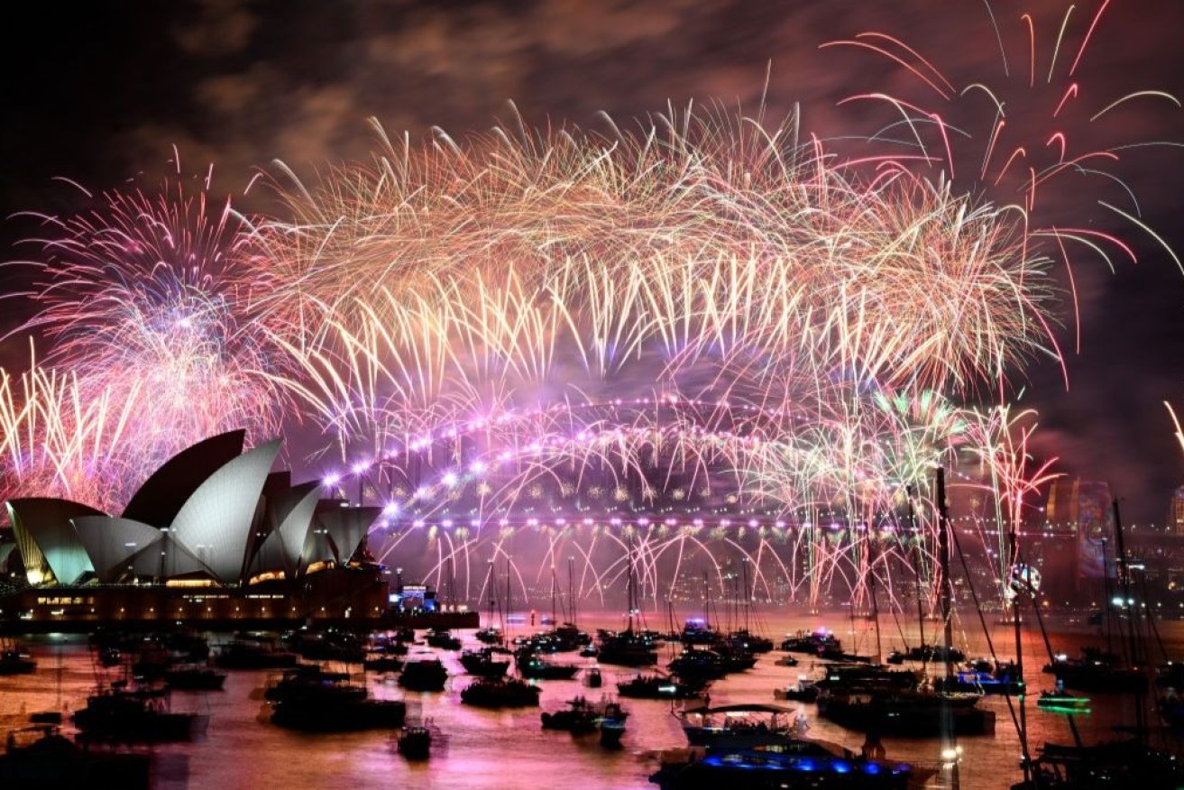 Sydney Harbour's famed fireworks awed crowds who arrived early to get a good spot.