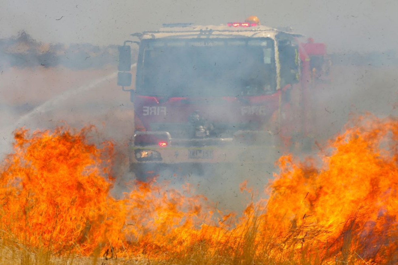 Hundreds of firefighters are battling a large bushfire threatening communities in Victoria's west.