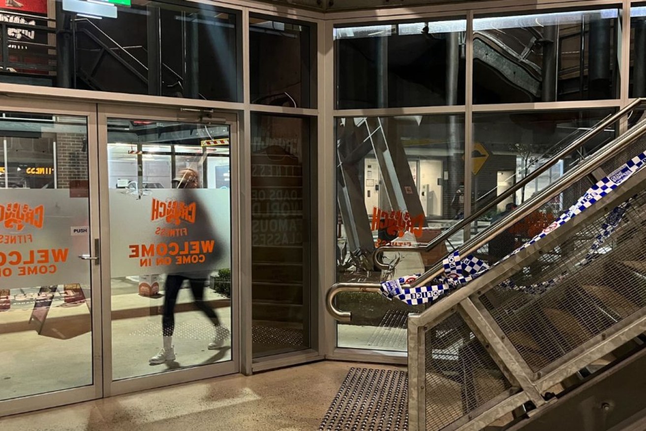 A man alleged to have stabbed a woman outside a Sydney gym has handed himself in nearly 24 hours after the attack.