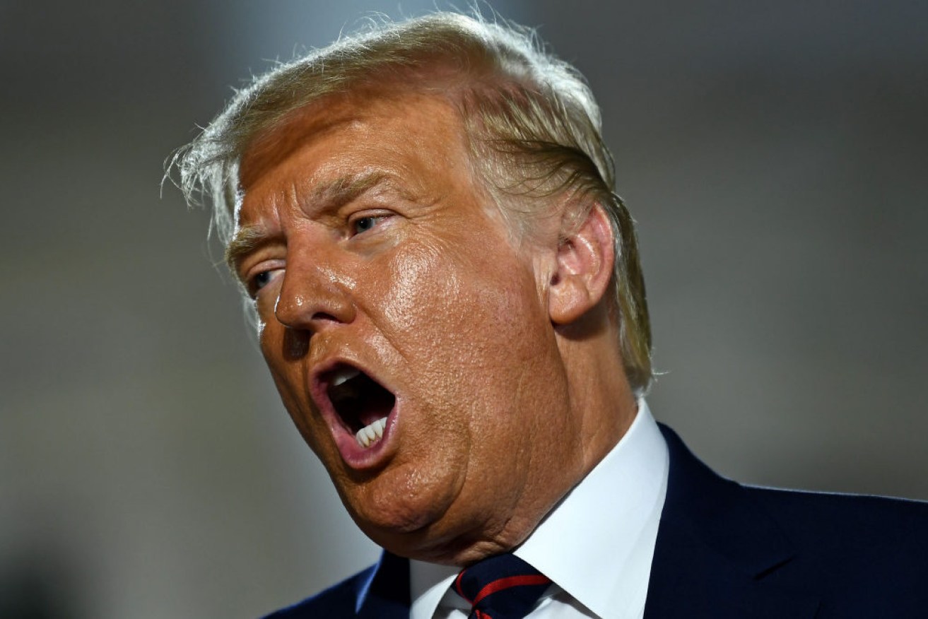 US President Donald Trump gestures after delivering his acceptance speech for the Republican Party nomination for reelection during the final day of the Republican National Convention at the South Lawn of the White House in Washington