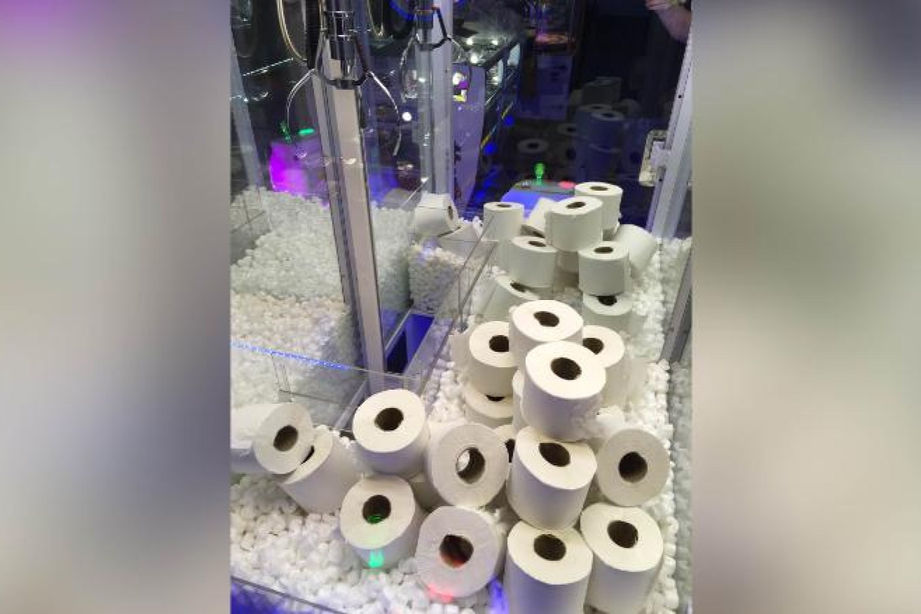 Rob Braddick has turned heads by swapping the toys in his toy grabber machine with toilet rolls. Photo: Rob Braddick