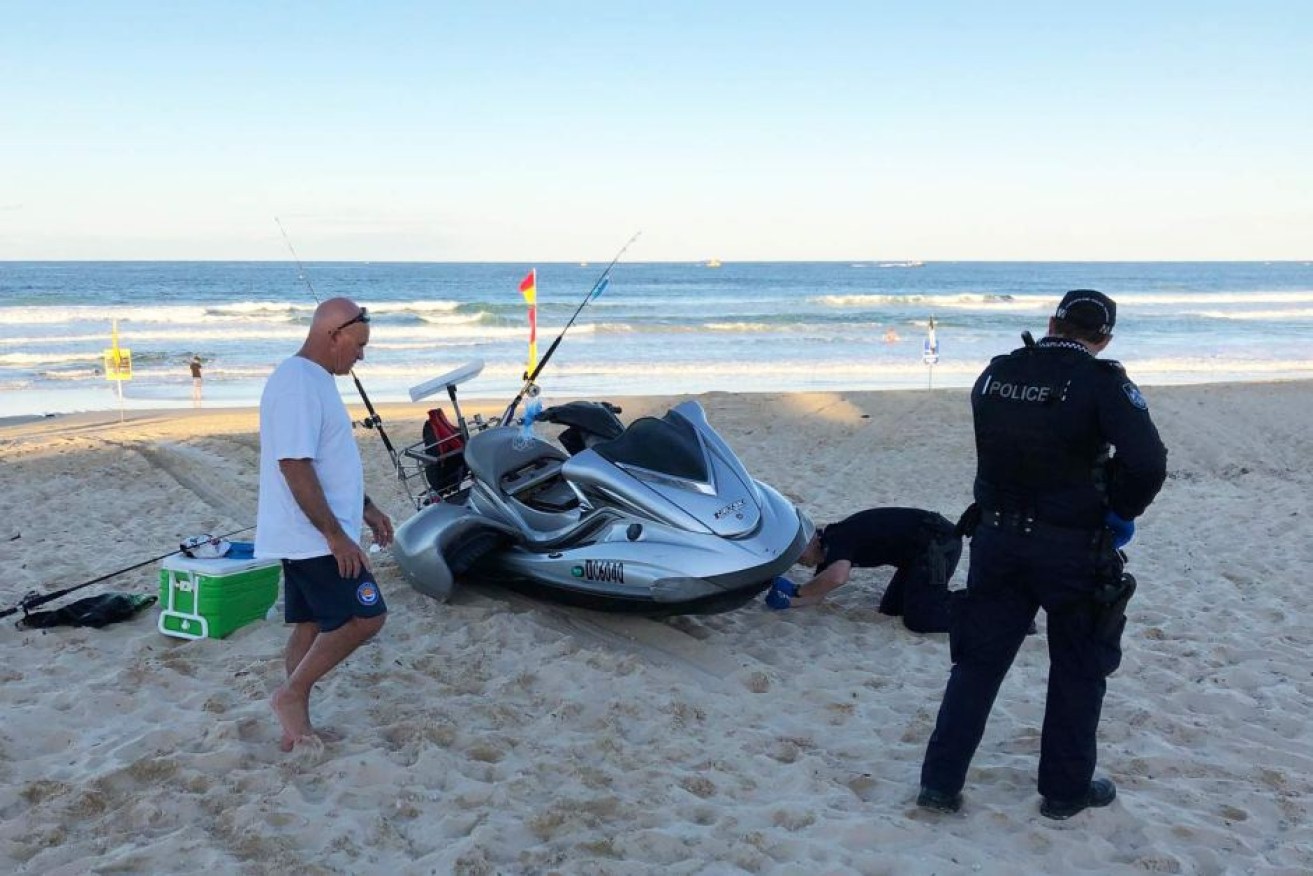 Two men were fishing from a jet ski when the craft began taking on water.