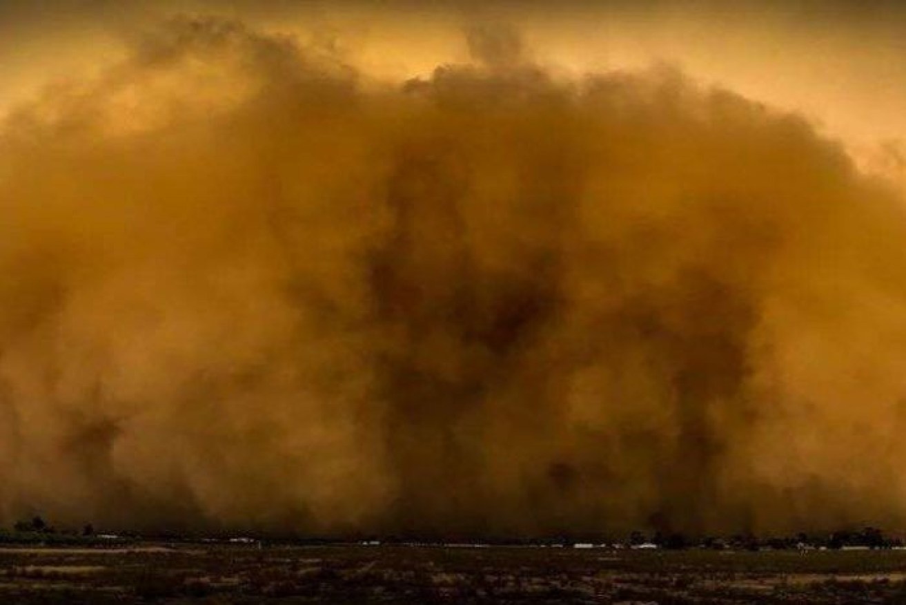 A wall of red dirt descends on the town of Mildura during an apocalyptic-like dust storm. 