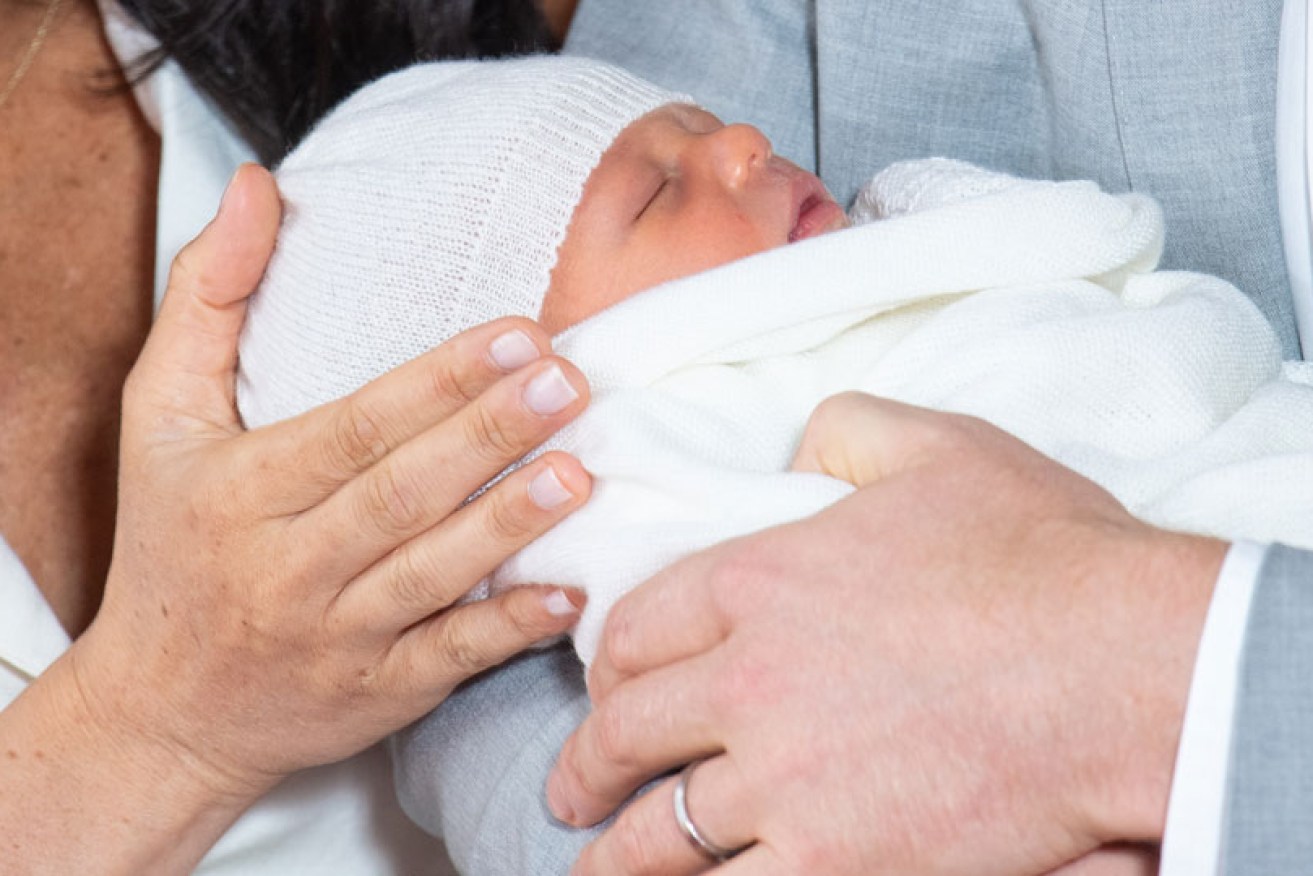 Baby Sussex (in Prince Harry's arms at Windsor Castle on May 8) is "calm", said mother Meghan Markle.