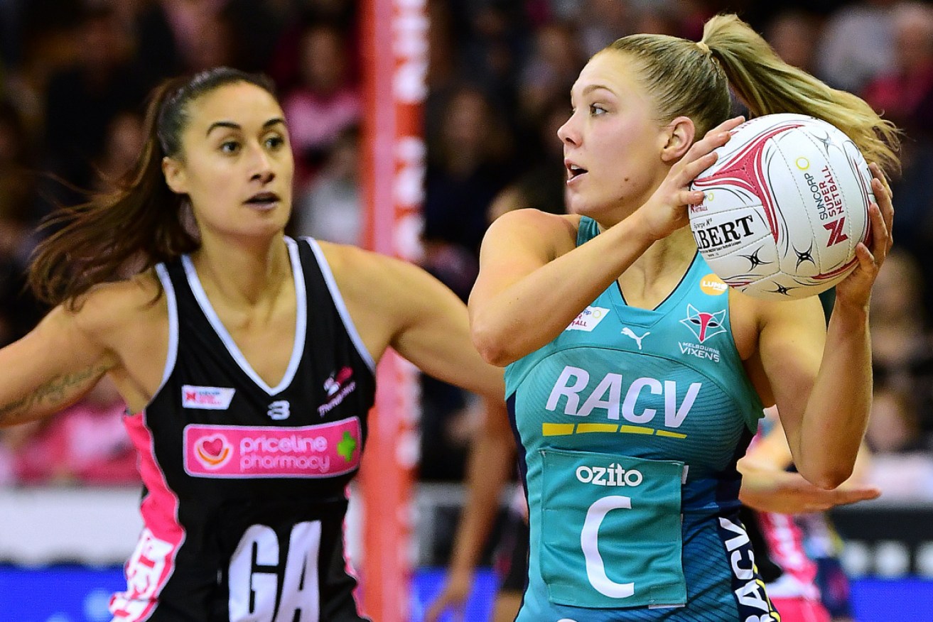 Kate Moloney of the Vixens moves forward against the Adelaide Thunderbirds. 