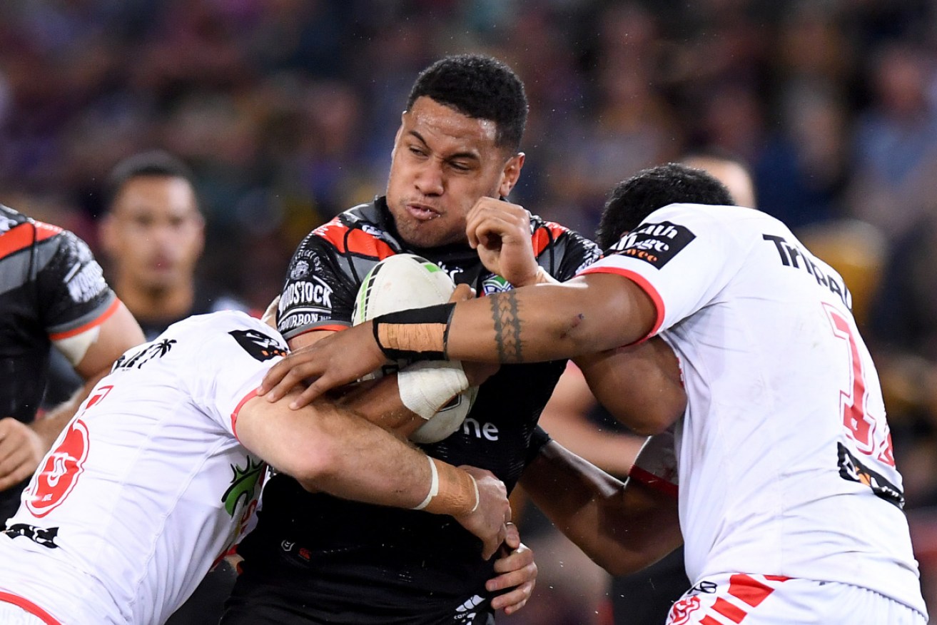 David Fusitua of the Warriors takes on the Dragons defence.  