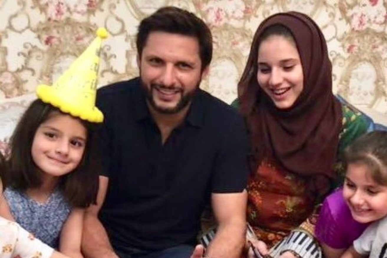 Shahid Afridi with two of his daughters and wife, Nadia, at his daughter Asmara's sixth birthday party.

