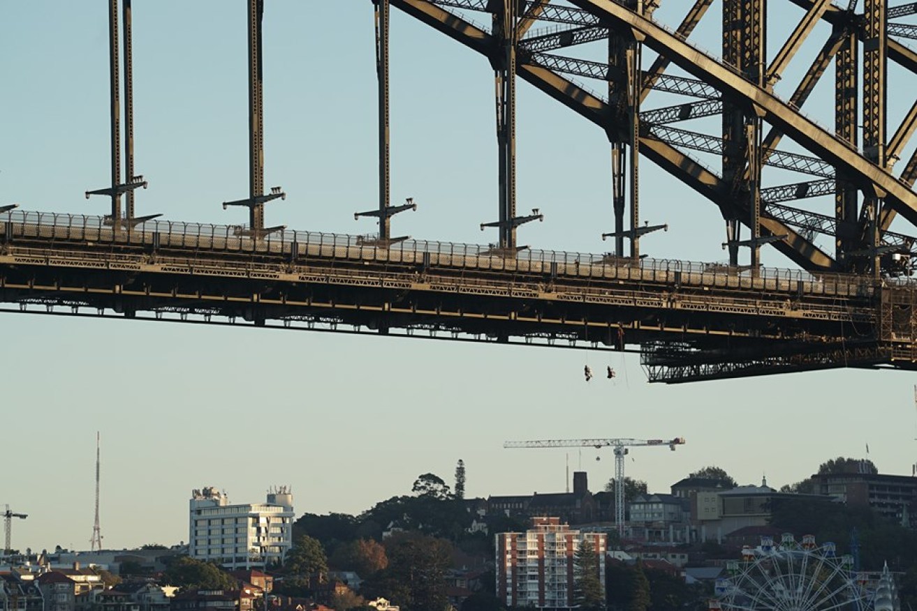 The protesters abseiled beneath the bridge and unfurled banners.